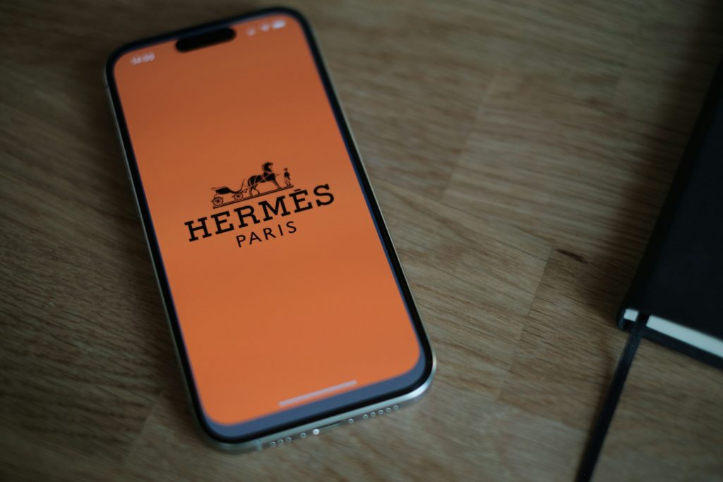 A cell phone sitting on top of a wooden table